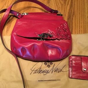 Patricia Nash Veneto tooled leather crossbody. Gorgeous raspberry color.